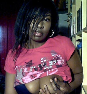 Nasty young ebony girl spreading her big black tits on webcam, camwhoring black teen